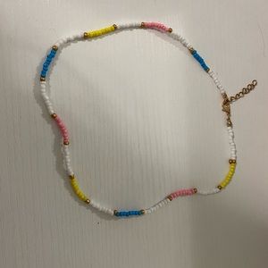 New shein necklace. White pink blue and yellow.